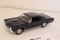 Front left view of dark blue 1966 Pontiac GTO model
