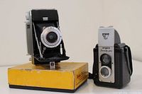 Argus Seventy-Five TLR and Kodak folding bellows camera on yellow Kodak box