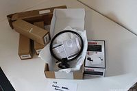 Lot overview showing towel ring, Delta tissue holder box, four plain boxes