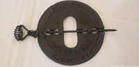 Front of damper showing CHAMPION and REVERSIBLE STEEL PIN lettering and spring handle