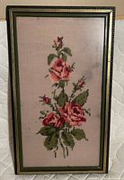 Front view of framed floral needlepoint