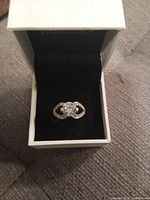 Ring in box showing design and center stone