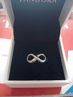front view of infinity ring in box