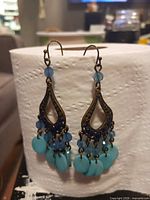Bronze-tone teardrop earrings with blue beads and turquoise discs