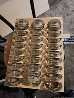 Tray displaying all 30 clear glass tealight holders