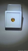 Front view of yellow Tourmaline in gem box