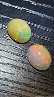 Two oval Ethiopian opals showing vivid play-of-color
