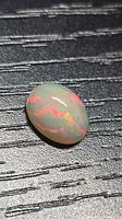 Oval cabochon Ethiopian opal showing multicolored fire