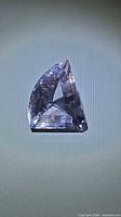 Front view of faceted amethyst showing fancy triangular cut
