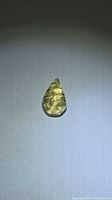 Front view of golden citrine showing leaf cut and grooves