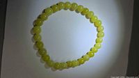 Full view of yellow jade stretch bracelet