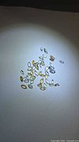 Spread of multicolored marquise tanzanites on white background