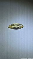 Marquise-cut yellow gemstone side profile