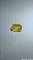 Front view of loose pastel yellow oval sapphire