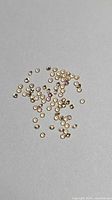 Loose round champagne sapphires spread on surface