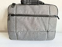 Front view showing quilted fabric, zipper pocket, overall condition