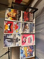 Front view of seven Wii game cases arranged on table