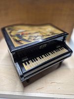 Overall view of miniature piano music box closed