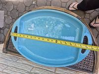 Top view showing blue platter, integrated handles and measurement tape across length