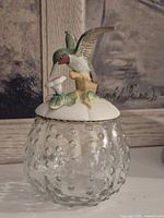 Full view of hobnail glass jar with porcelain hummingbird lid