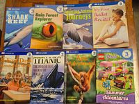 Eight DK Readers titles including Shark Reef and Titanic
