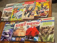 Eight early reader and National Geographic Kids paperbacks on table
