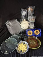 Group shot shows all kitchen items including plates, risers, glasses, ceramics