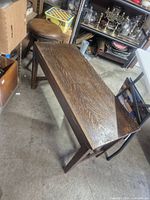 Full view of oak piano bench top and legs