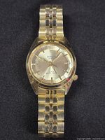 Front view of wristwatch showing dial, bracelet and overall finish