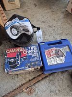 Overall lot showing three packaged tire chain sets