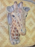 Front view of sculpted giraffe head wall mount