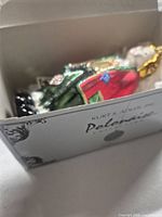 Ornament and box inside showing protective packing