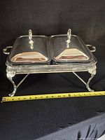 Full view of double chafing server with lids in place, measuring tape for scale