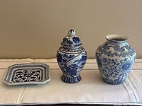 Group shot of both vases and plate