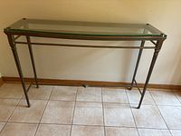 front view of glass and metal console table