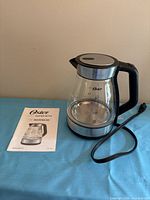 Kettle with attached power cord and user manual