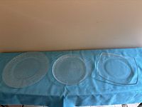 All three clear glass serving plates displayed