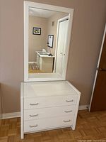 Dresser with mirror above