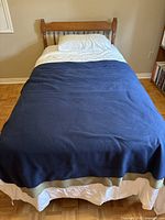 Complete view of assembled single bed with bedding