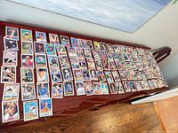 Wide view of entire spread of Topps baseball cards on table