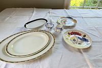 Group shot showing all eight serveware pieces arranged on table