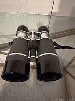 Front view of binoculars showing objective lenses and overall condition