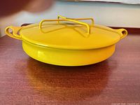 Side view of casserole with lid on showing color and shape