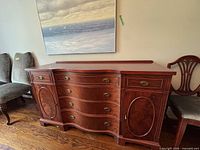 Full frontal view of Hespeler bow-front sideboard showing drawers, doors, and finish