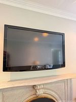 Front view of LG 47-inch TV mounted on wall