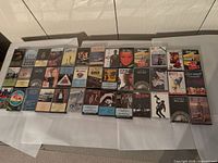 All cassettes laid out in rows on table