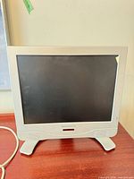 Front view of Magnavox 15-inch LCD TV on stand
