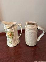 Front view of both pitchers