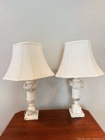 Front view of both marble table lamps with shades