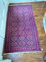 Full view of wool runner rug on hardwood floor